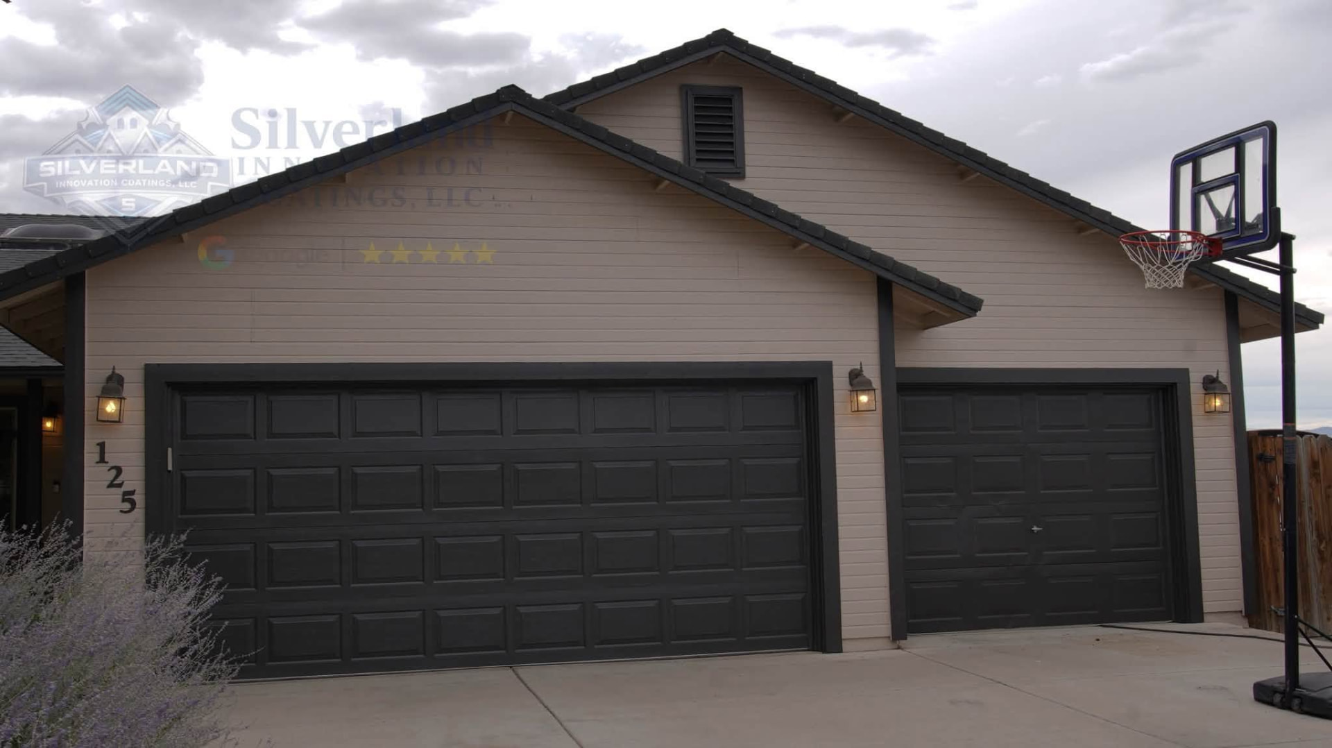 Dark painted garage doors on a modern home